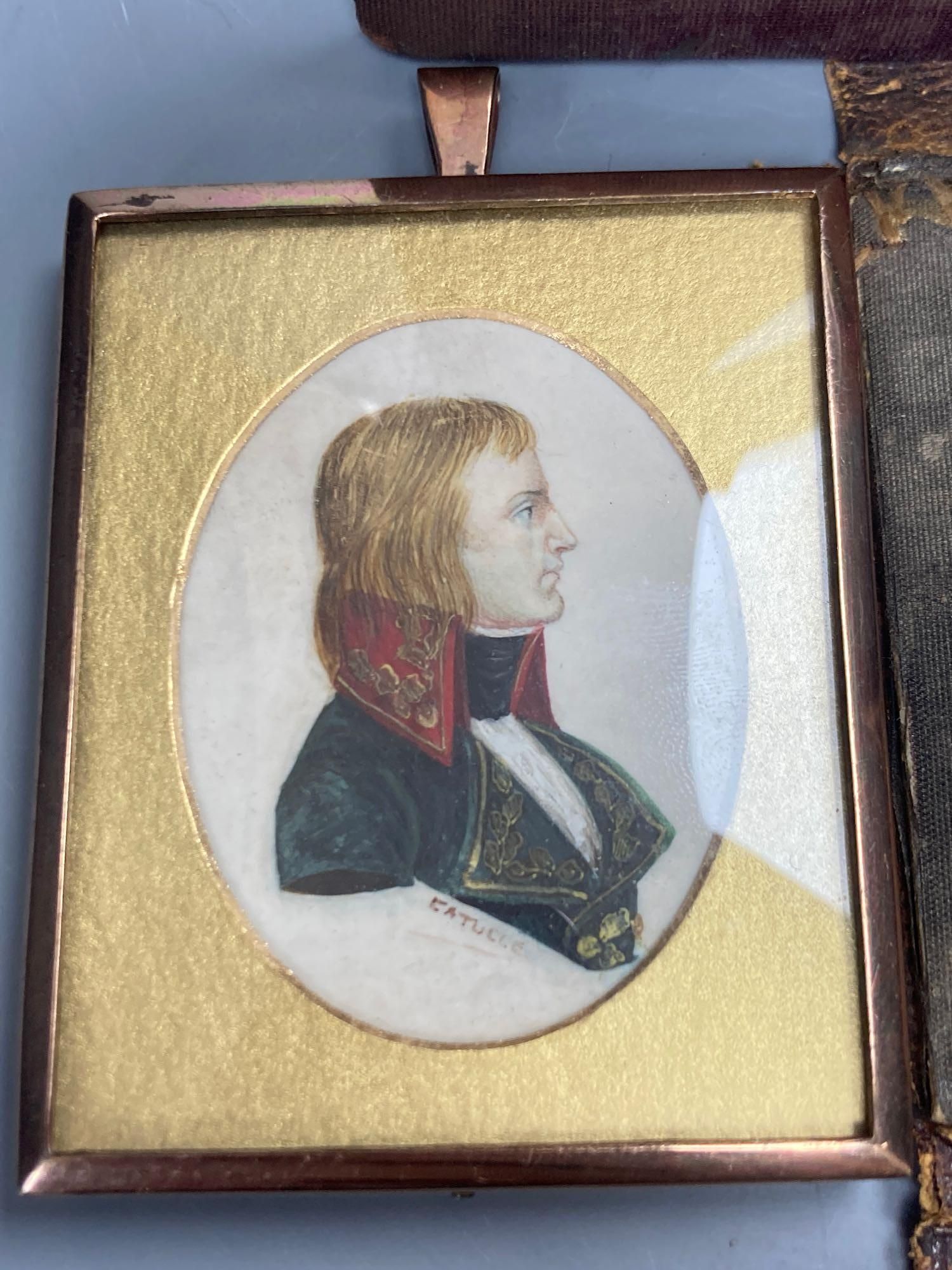 Five assorted miniatures of gentleman including one in yellow metal frame, largest being an oval portrait in a brown velvet frame, 5cm